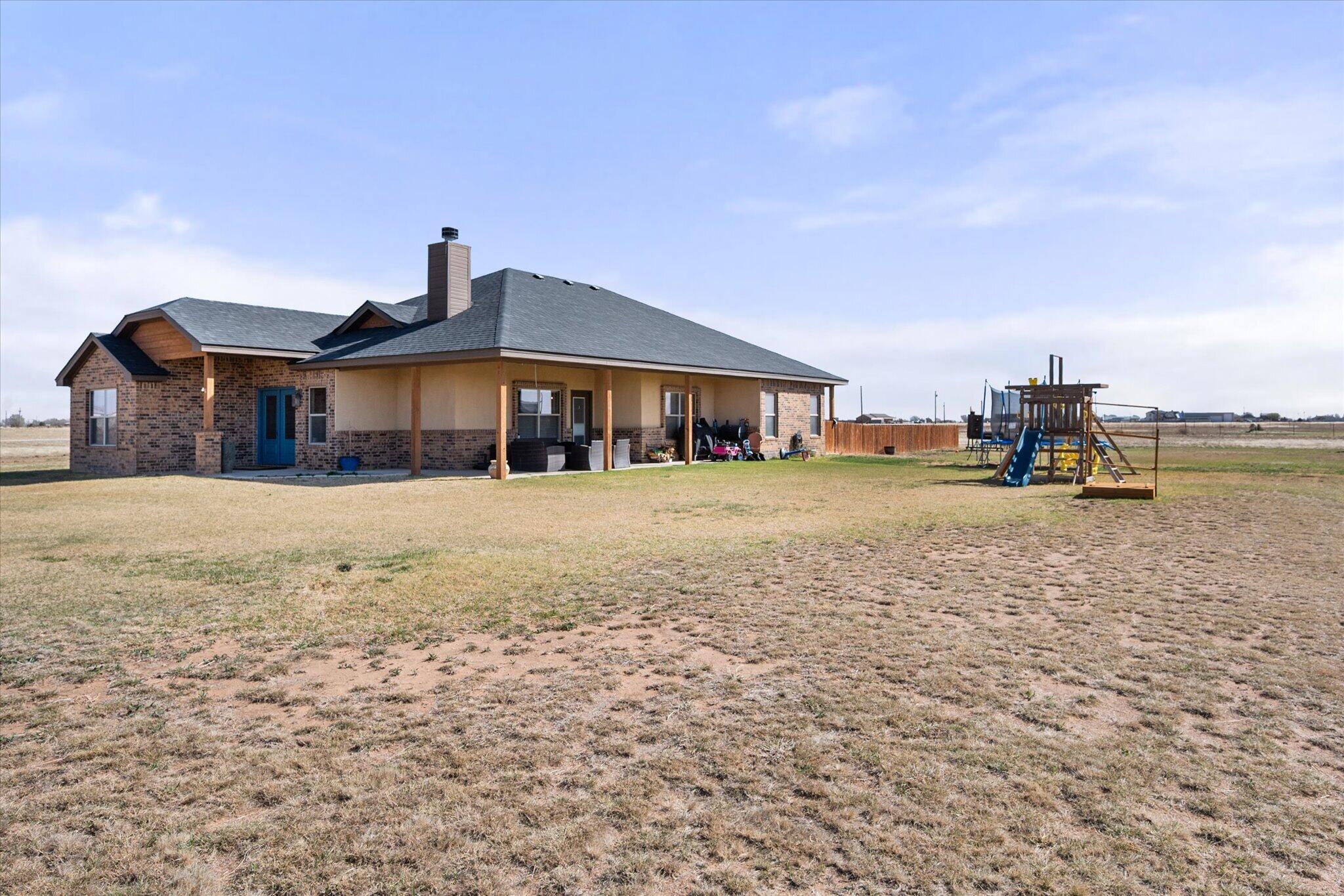 3263 Quail Road Lubbock, TX 79407 - Photo 31 of 46 a front view of a building with lake view
