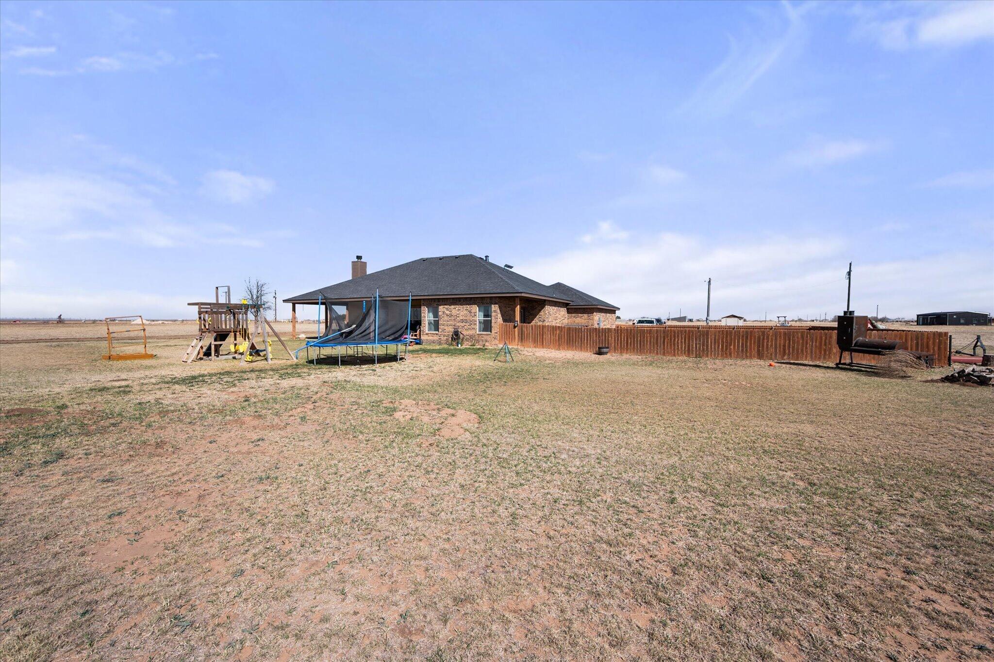 3263 Quail Road Lubbock, TX 79407 - Photo 34 of 46 a view of a lake with houses