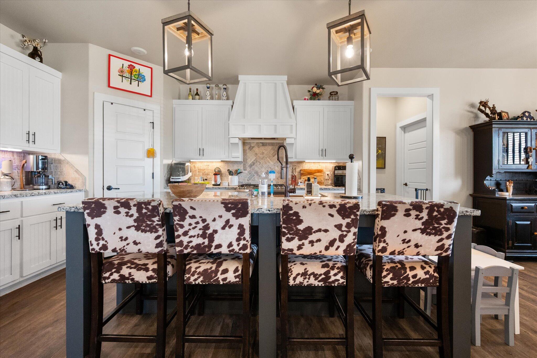 3263 Quail Road Lubbock, TX 79407 - Photo 10 of 46 a living room with furniture and a chandelier