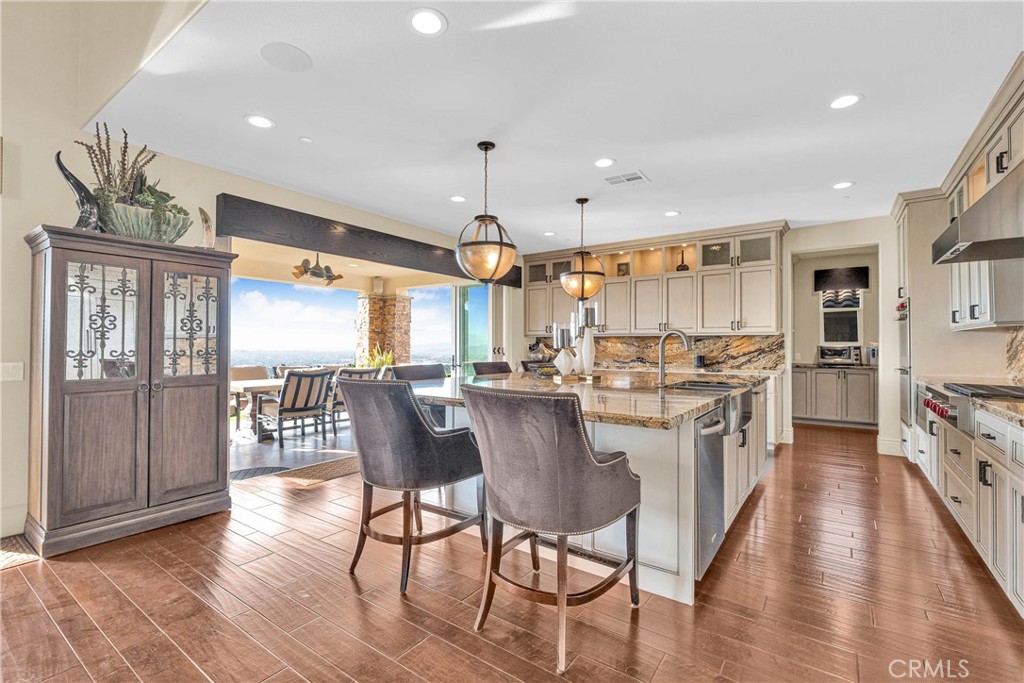 16727 Pienza Court Riverside, CA 92503 - Photo 5 of 41 Wolf cooktop, bookmatched granite island, view included