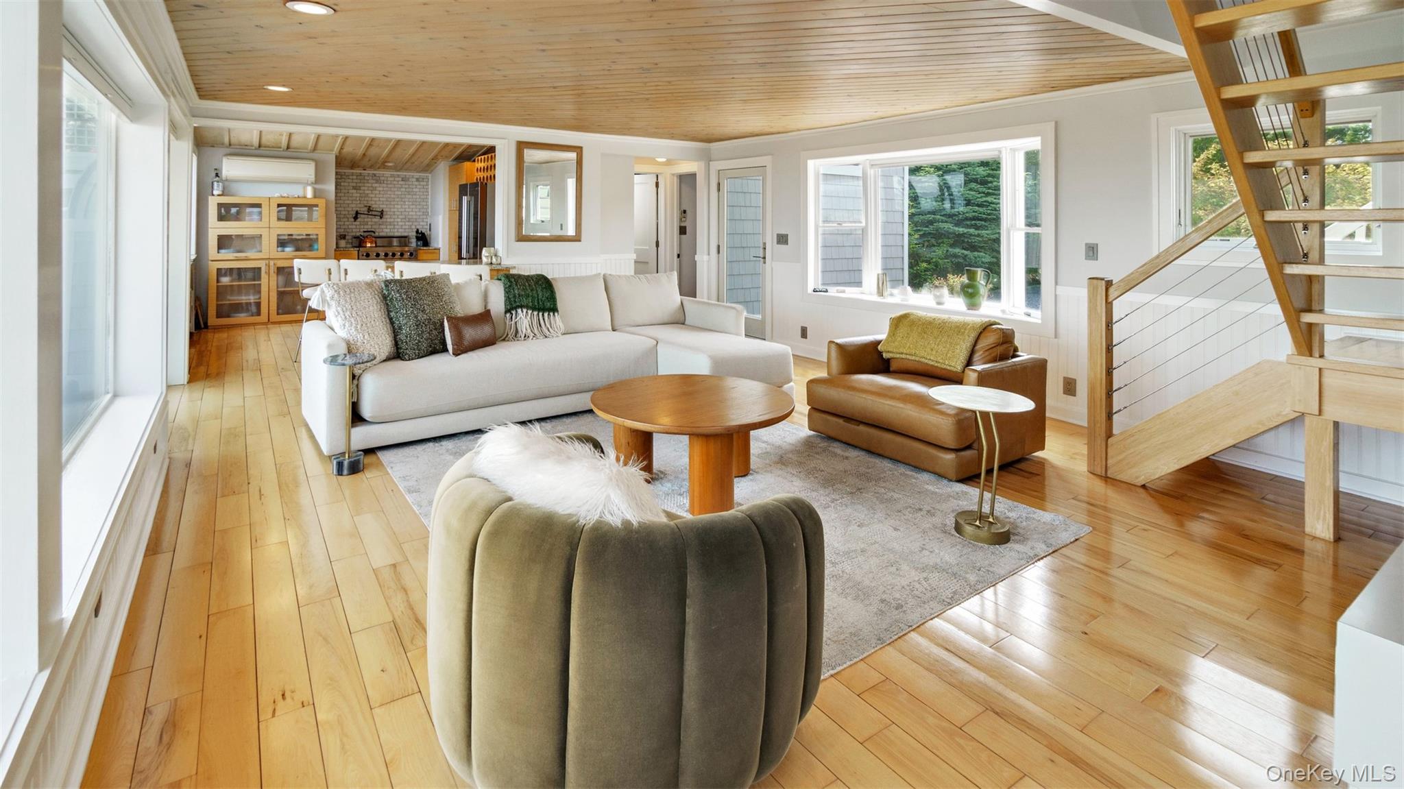 12910 Main Road East Marion, NY 11939 - Photo 14 of 41 a living room with furniture and a large window