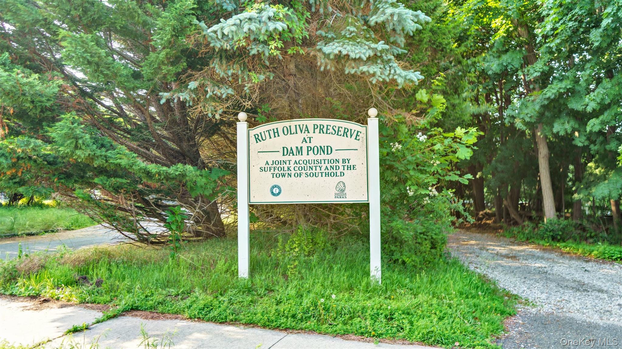 12910 Main Road East Marion, NY 11939 - Photo 36 of 41 a sign on the side of the road