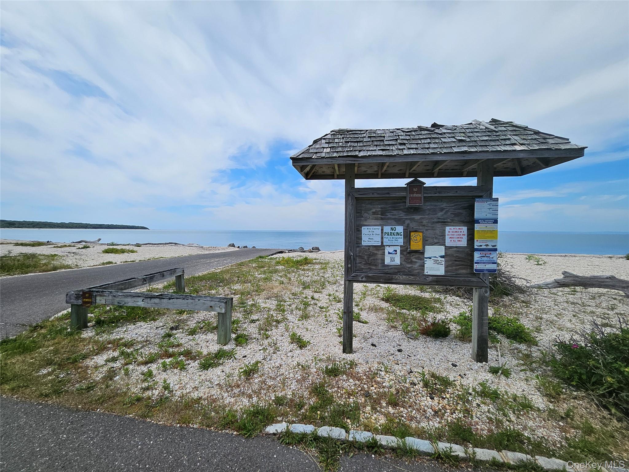 12910 Main Road East Marion, NY 11939 - Photo 37 of 41 a view of a terrace with a ocean view
