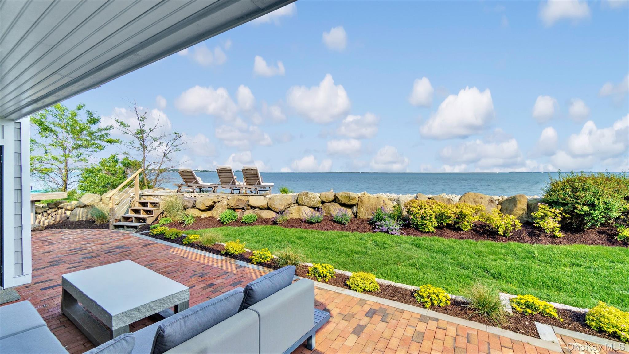 12910 Main Road East Marion, NY 11939 - Photo 6 of 41 a view of yard with swimming pool and green space