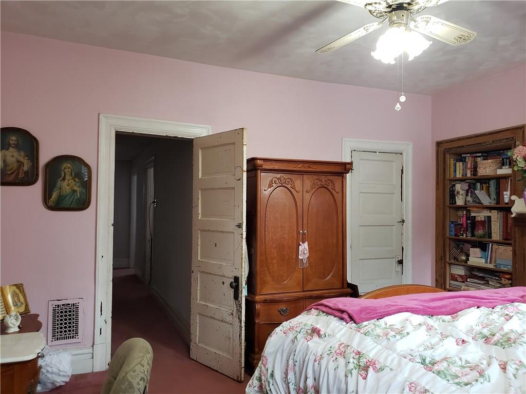 4218 Calvin Street Pittsburgh, PA 15201 - Photo 10 of 25 High baseboards, original 5 panel doors and wide trim.