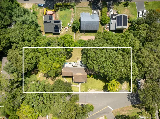 an aerial view of residential house with outdoor space