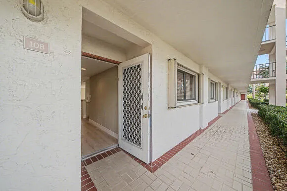 a view of an empty room with glass door