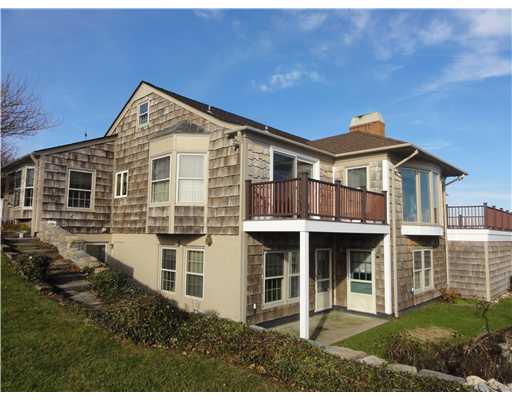 276 Ocean Road Narragansett, RI 02882 - Photo 3 of 19 Exterior Back. Exterior west side of the home, decks overlook sprawling lawn to shoreline, nicely landscaped yard.
