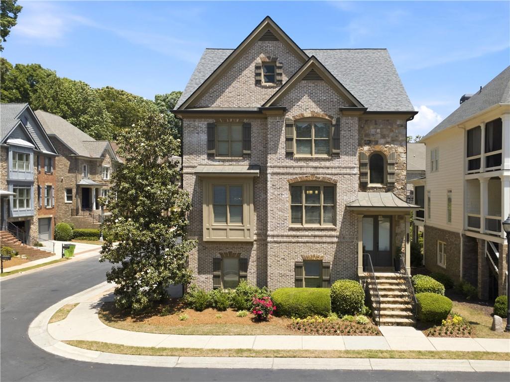 7988 Magnolia Square Atlanta, GA 30350 - Photo 1 of 33 a front view of a house with a yard