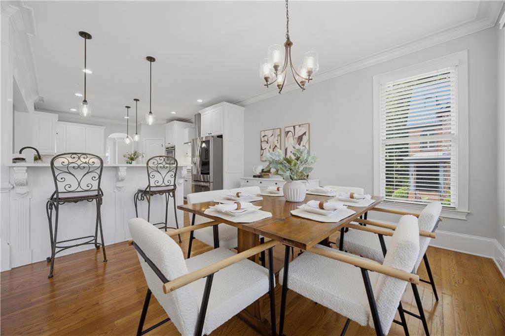 7988 Magnolia Square Atlanta, GA 30350 - Photo 12 of 33 a view of a dining room with furniture window and wooden floor