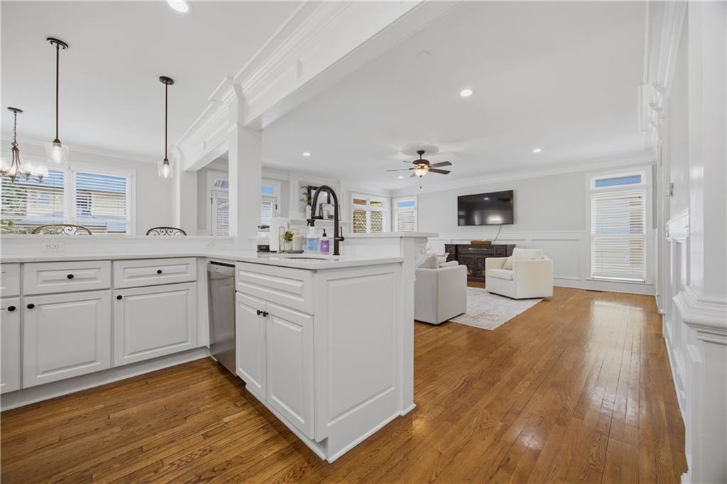 7988 Magnolia Square Atlanta, GA 30350 - Photo 17 of 33 a kitchen with cabinets and wooden floor