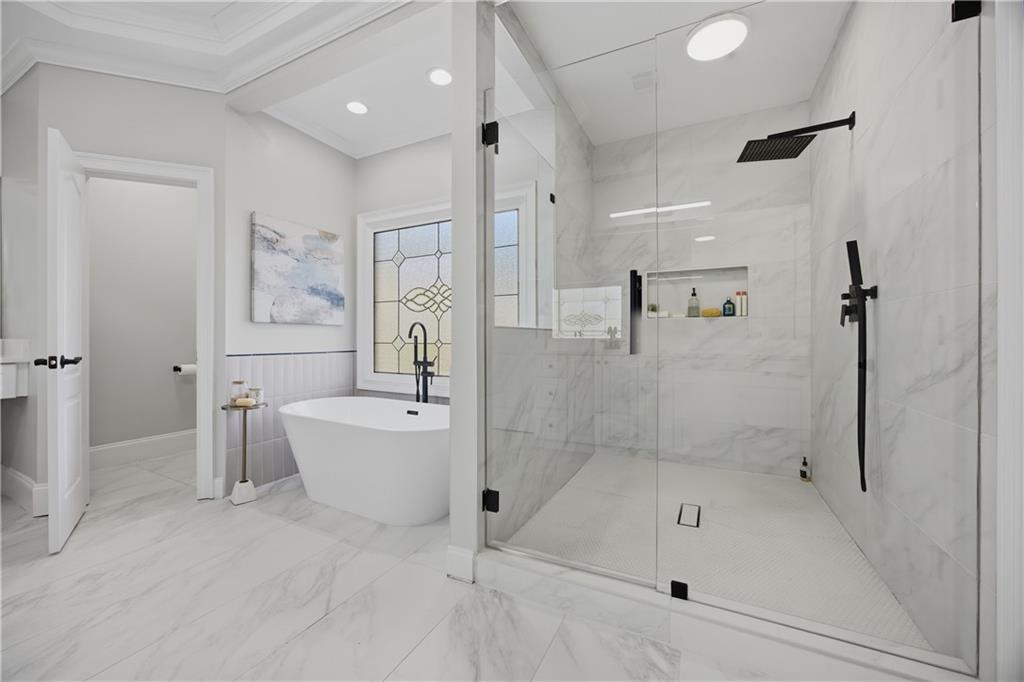 7988 Magnolia Square Atlanta, GA 30350 - Photo 21 of 33 a bathroom with a bathtub shower and toilet