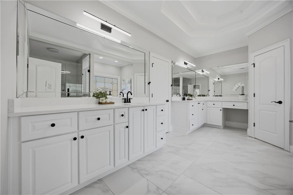 7988 Magnolia Square Atlanta, GA 30350 - Photo 22 of 33 a large bathroom with a double vanity sink mirror and