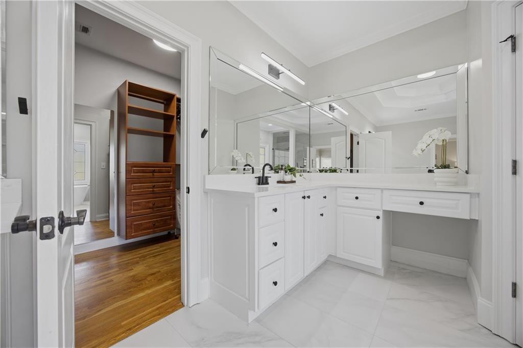 7988 Magnolia Square Atlanta, GA 30350 - Photo 23 of 33 a bathroom with a double vanity sink and mirror