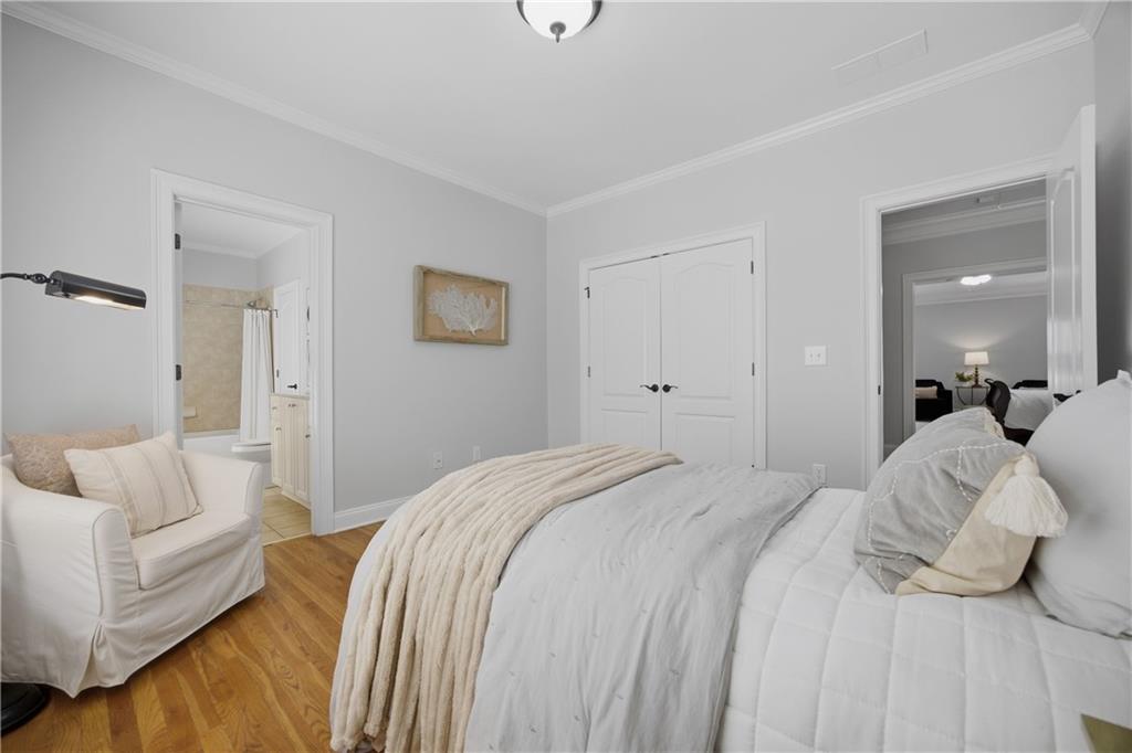 7988 Magnolia Square Atlanta, GA 30350 - Photo 25 of 33 a bedroom with a bed and a couch