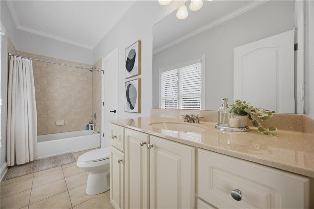 7988 Magnolia Square Atlanta, GA 30350 - Photo 26 of 33 a bathroom with a granite countertop sink mirror vanity and toilet