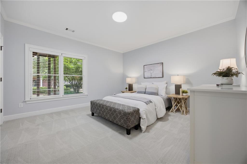 7988 Magnolia Square Atlanta, GA 30350 - Photo 30 of 33 a spacious bedroom with a bed and a window