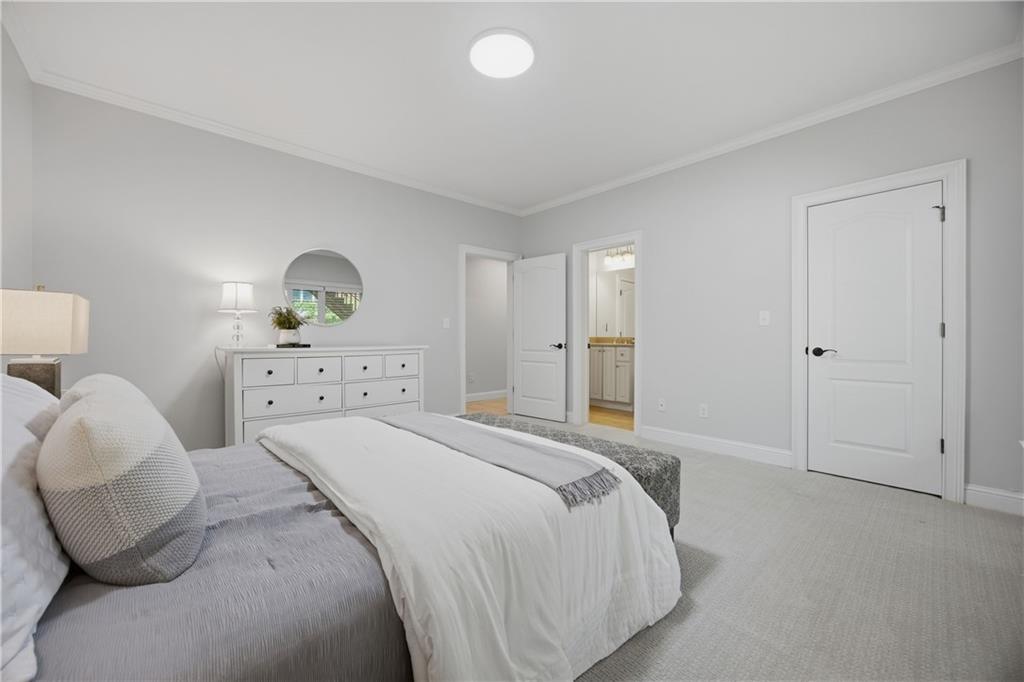 7988 Magnolia Square Atlanta, GA 30350 - Photo 31 of 33 a bedroom with a bed and a window