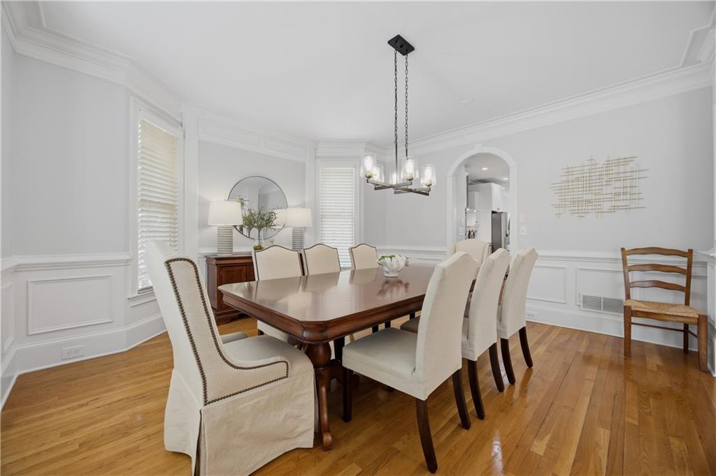 7988 Magnolia Square Atlanta, GA 30350 - Photo 4 of 33 a view of a dining room with furniture window and wooden floor