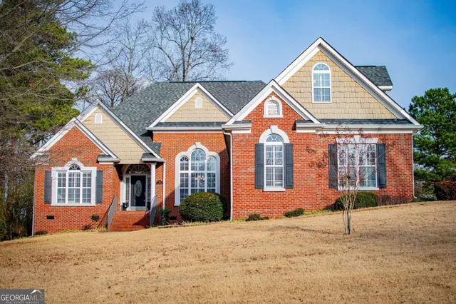 a front view of a house with a yard