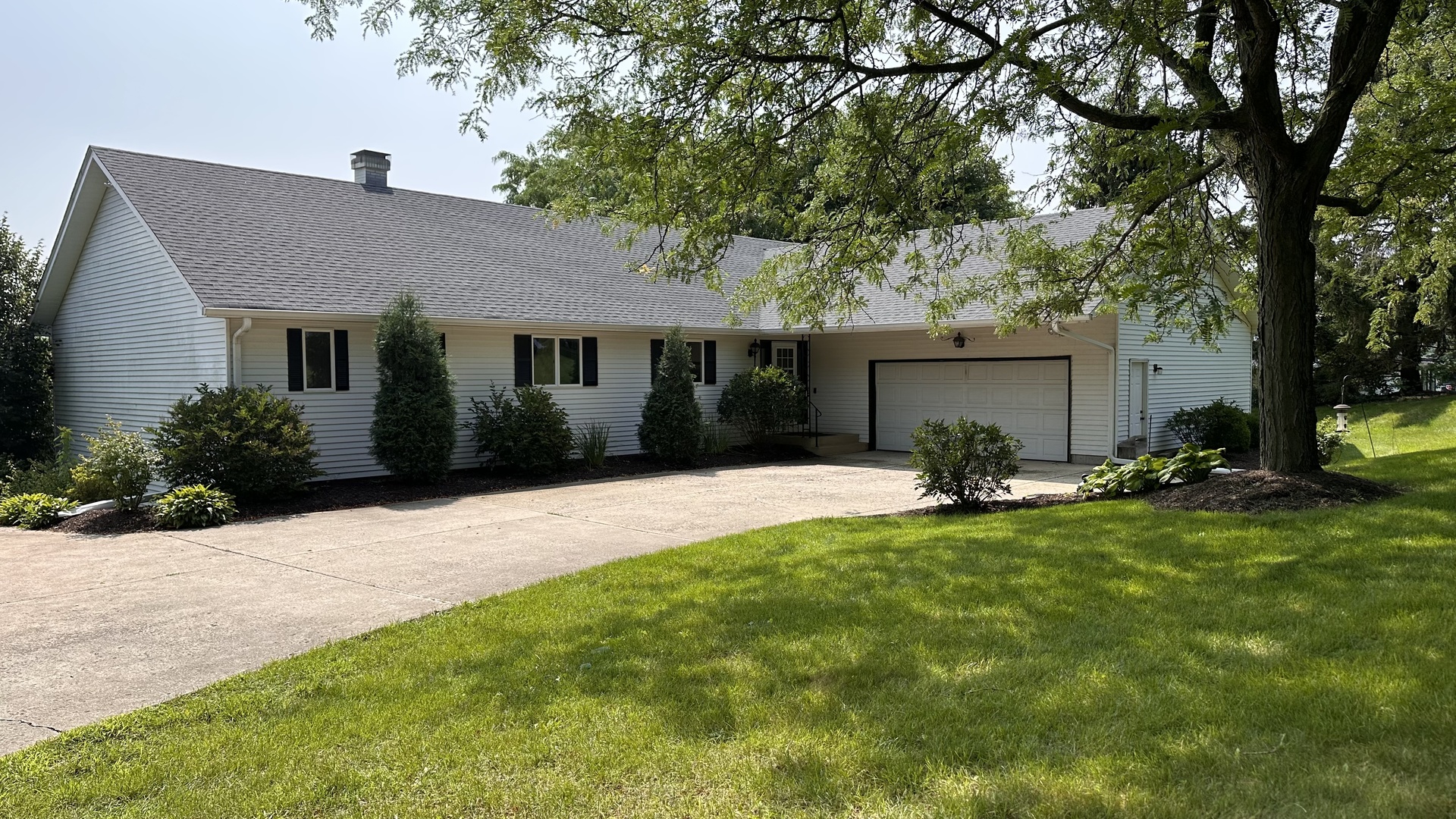 2N455 LaFox Road Elburn, IL 60119 - Photo 1 of 60 a front view of a house with a yard and trees