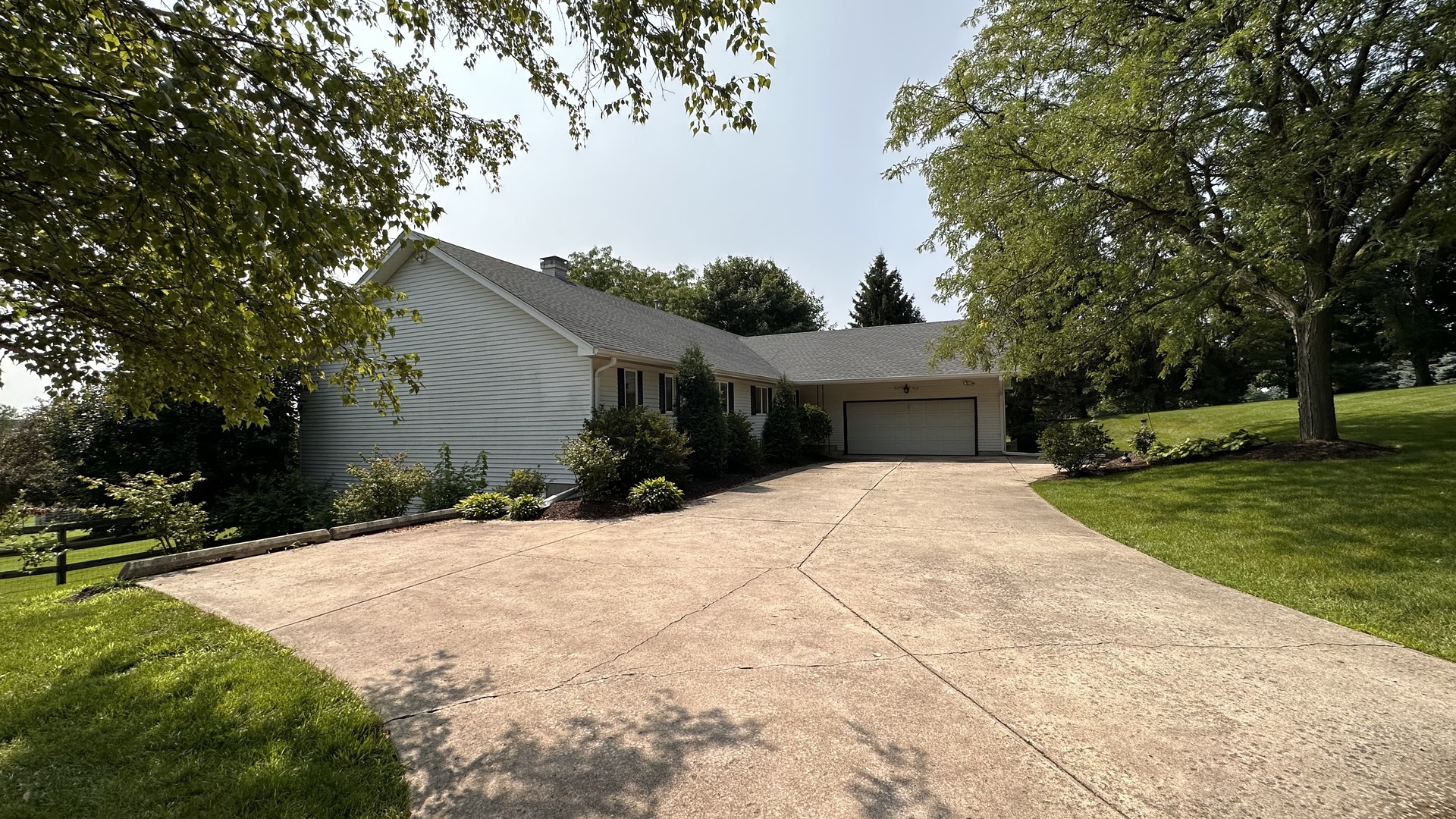 2N455 LaFox Road Elburn, IL 60119 - Photo 56 of 60 a front view of a house with a yard and garage