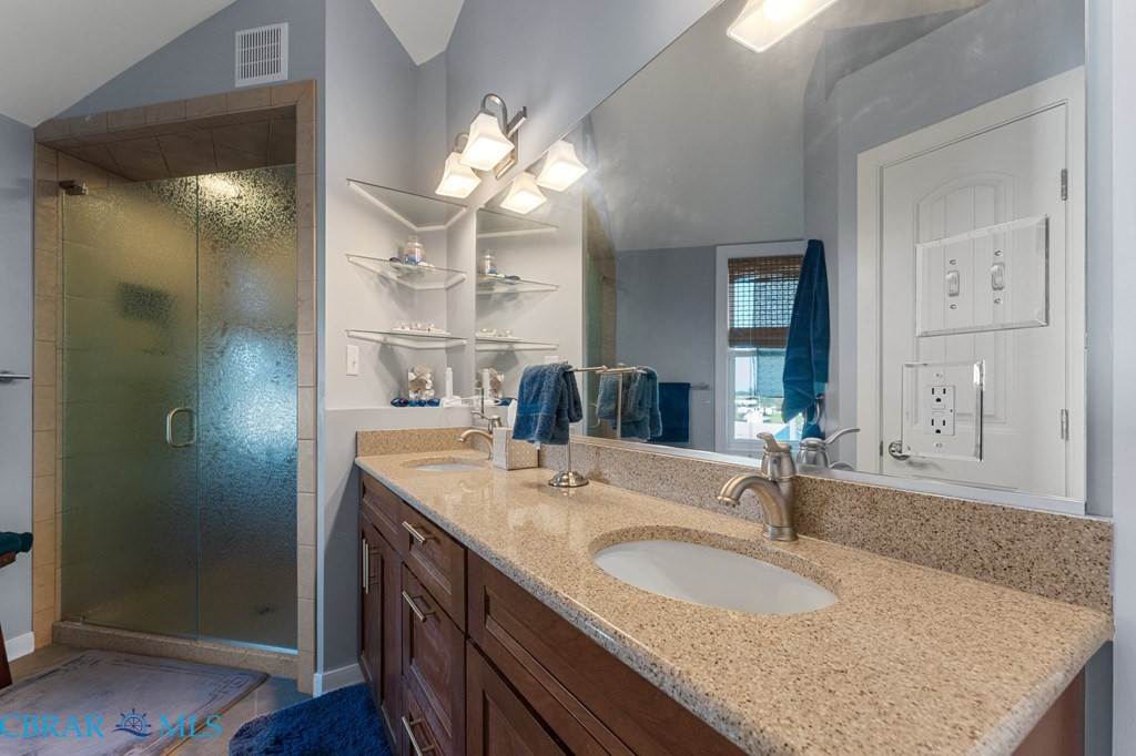 24 River Road Lottsburg, VA 22511 - Photo 29 of 35 a bathroom with a granite countertop double vanity sink and a mirror