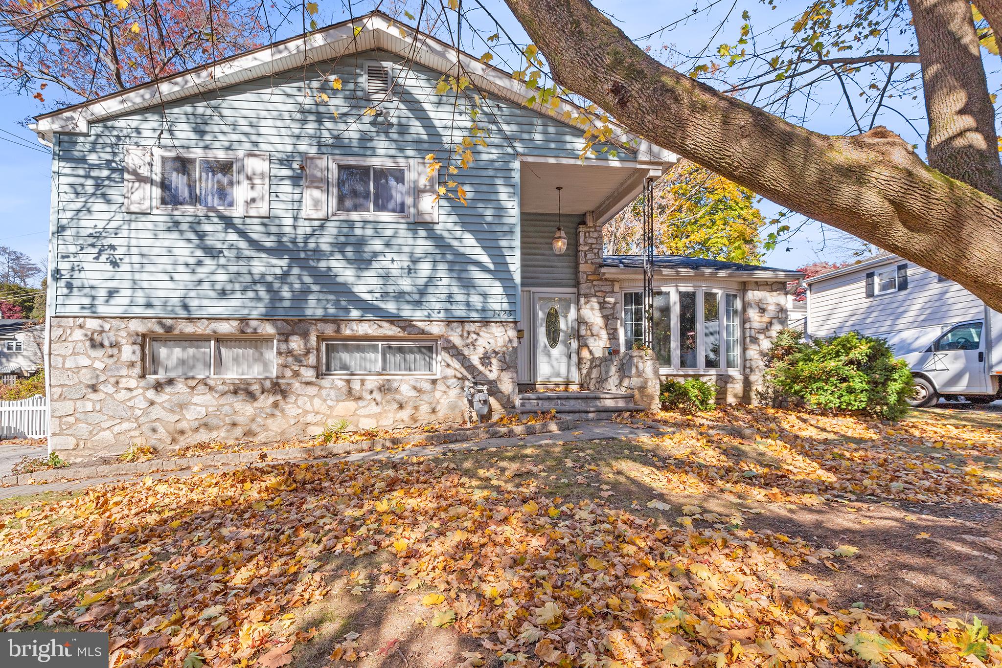 1725 Lawrence Road Havertown, PA 19083 - Photo 1 of 26 a brick building with a large tree in front of it