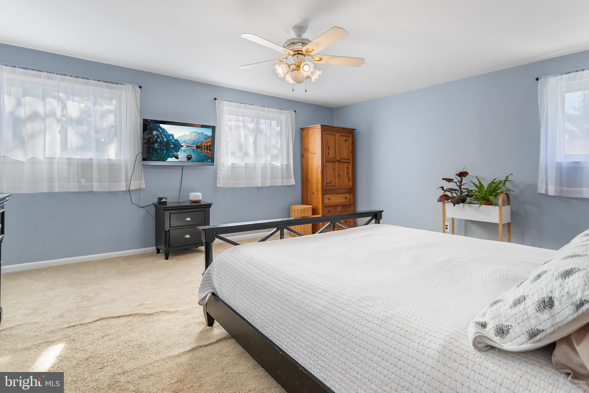 1725 Lawrence Road Havertown, PA 19083 - Photo 11 of 26 a bedroom with a bed and a table in it
