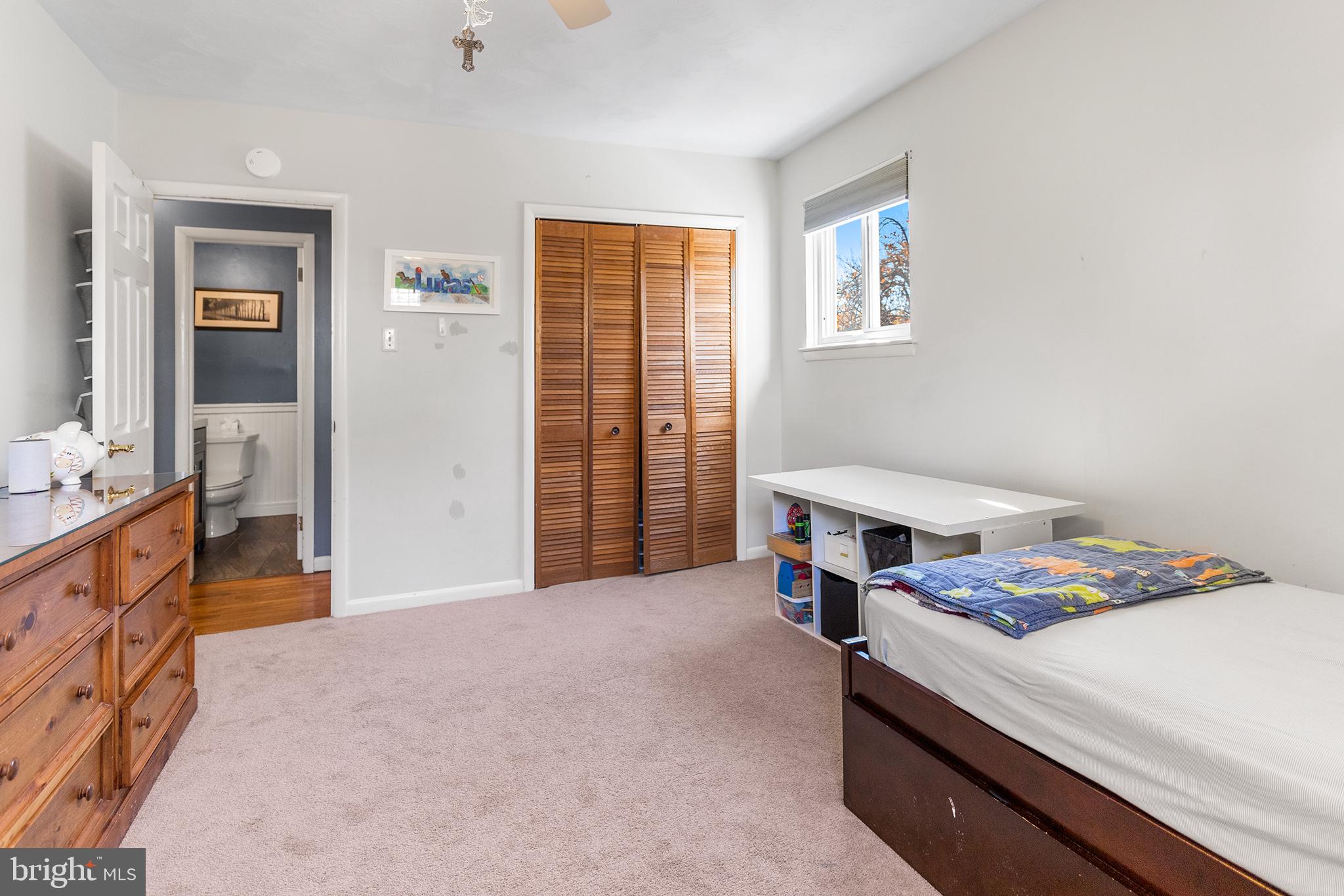 1725 Lawrence Road Havertown, PA 19083 - Photo 19 of 26 a bedroom with a bed and a dresser in it
