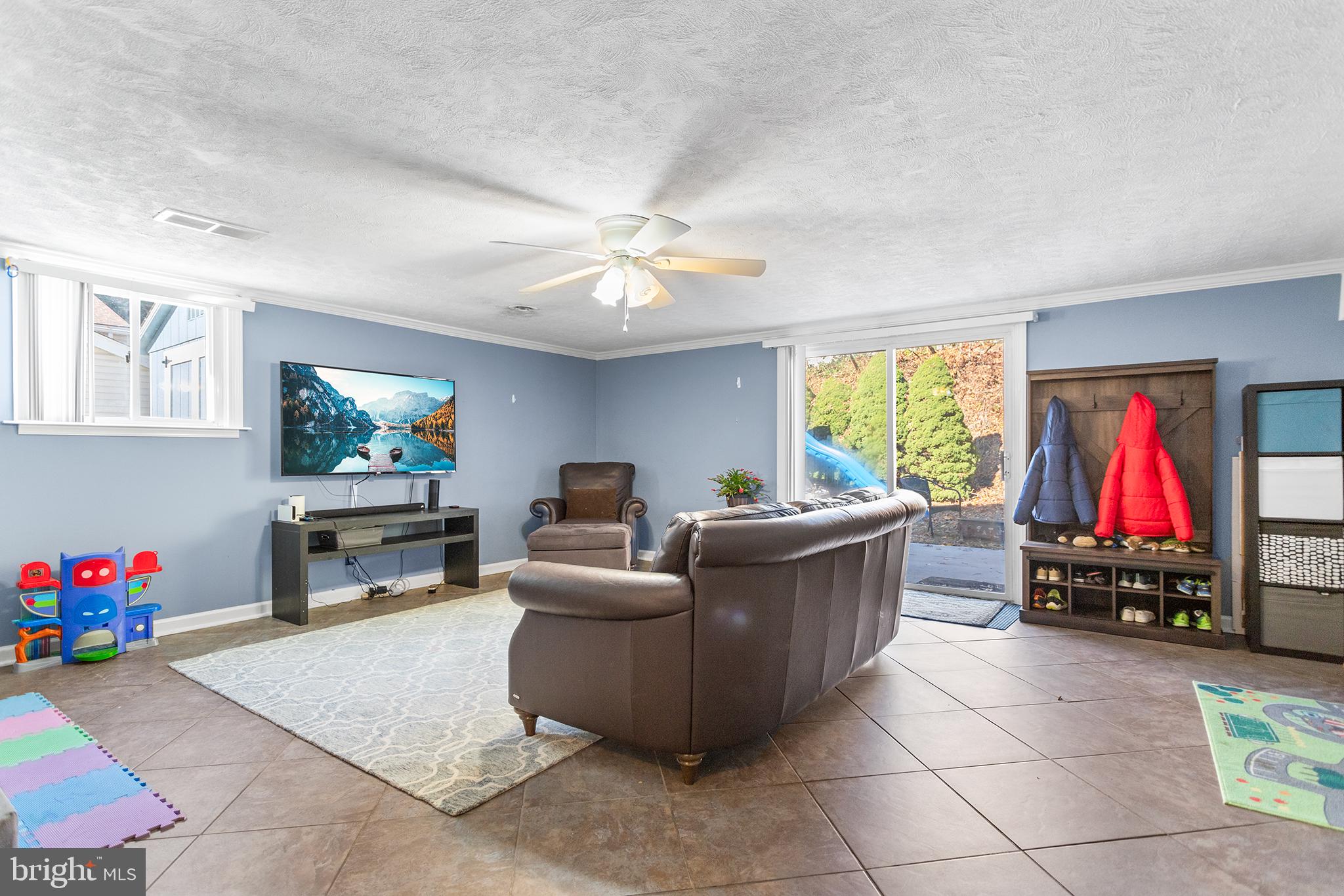 1725 Lawrence Road Havertown, PA 19083 - Photo 20 of 26 a living room with furniture and a flat screen tv