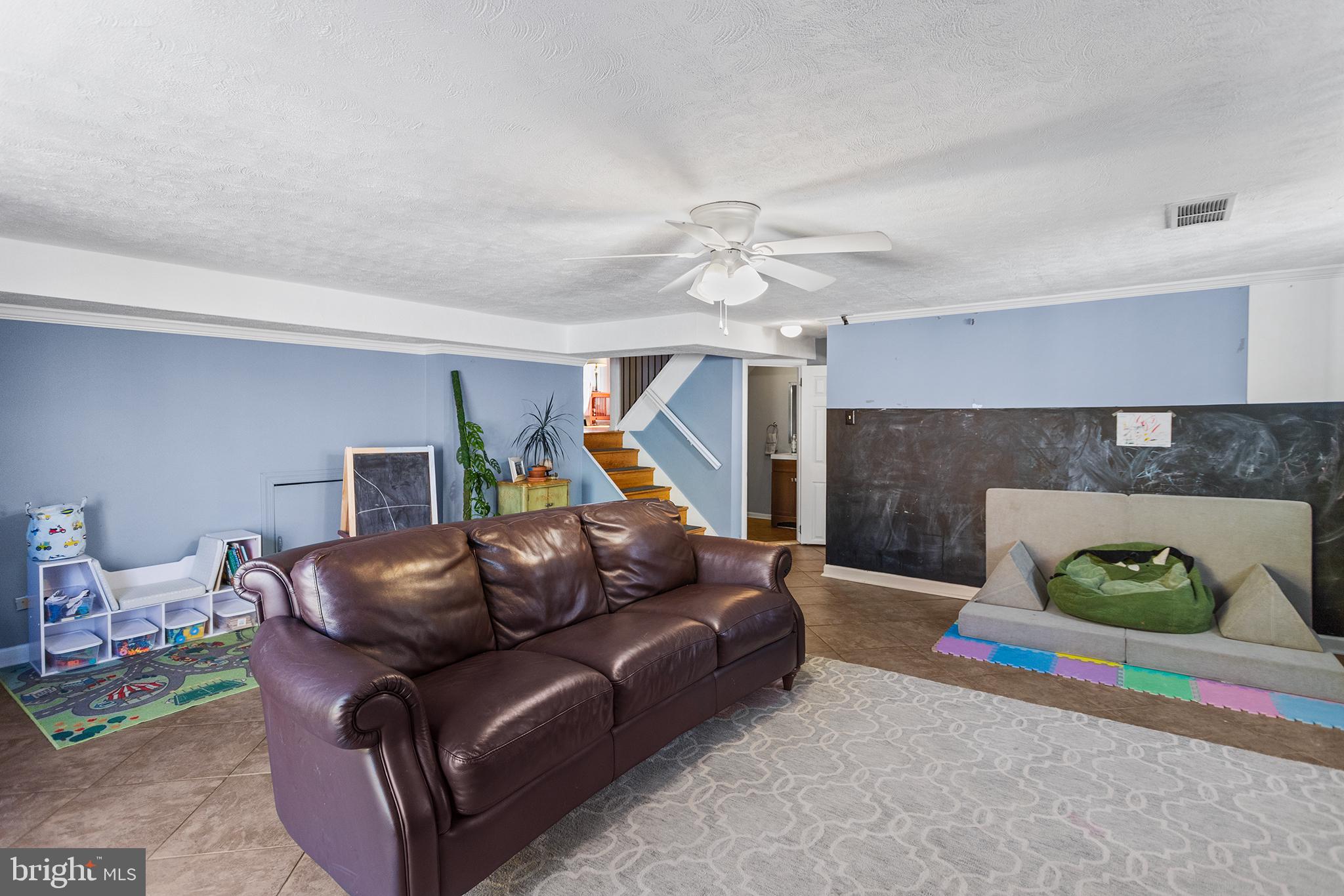 1725 Lawrence Road Havertown, PA 19083 - Photo 21 of 26 a living room with furniture and a fireplace