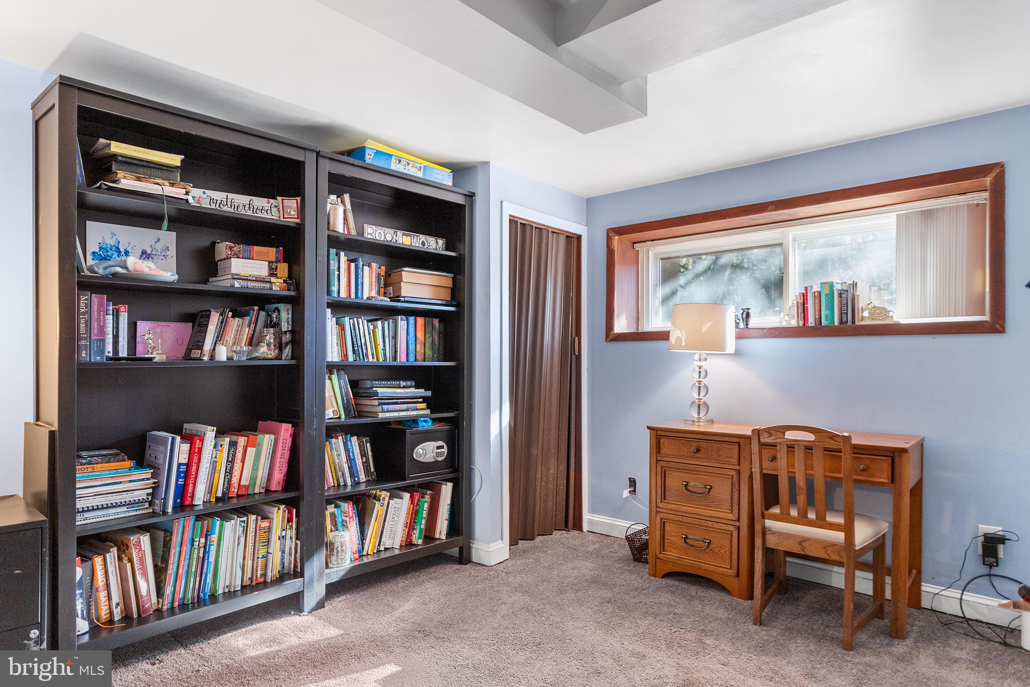 1725 Lawrence Road Havertown, PA 19083 - Photo 23 of 26 a view of a workspace with bookshelf