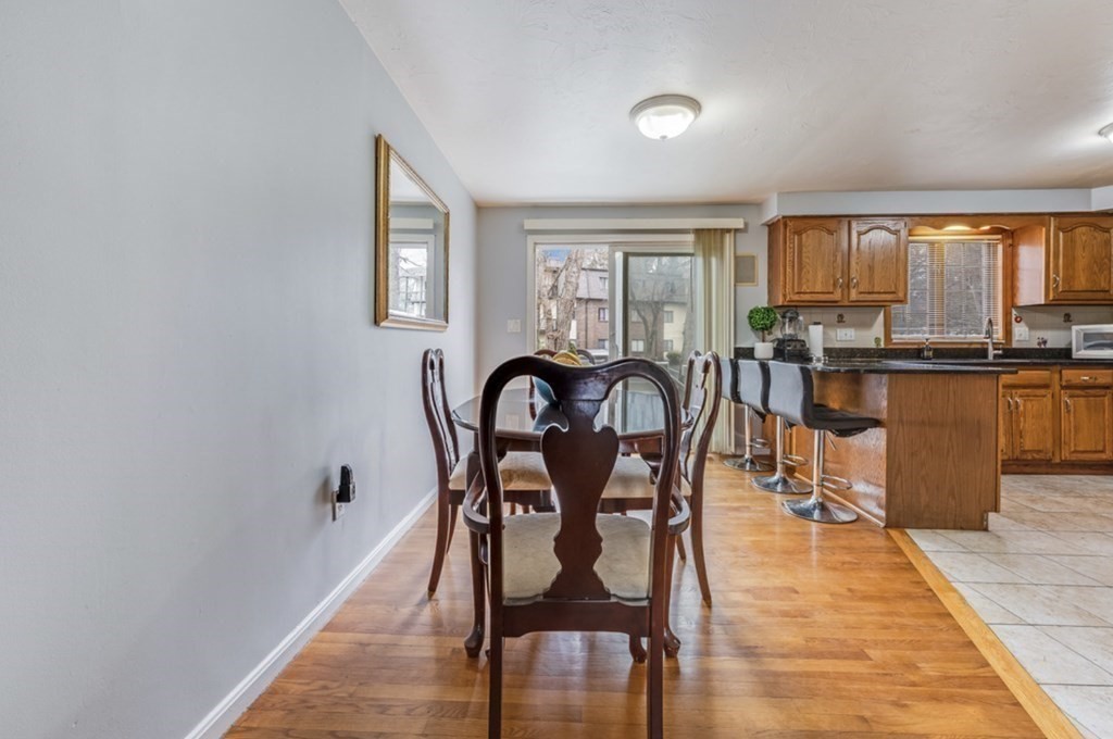 105 Irving Road, Unit 105 Randolph, MA 02368 - Photo 5 of 17 a view of a dining room with furniture window and outside view