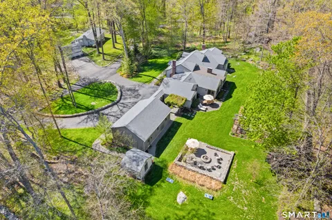 an aerial view of a house with a swimming pool