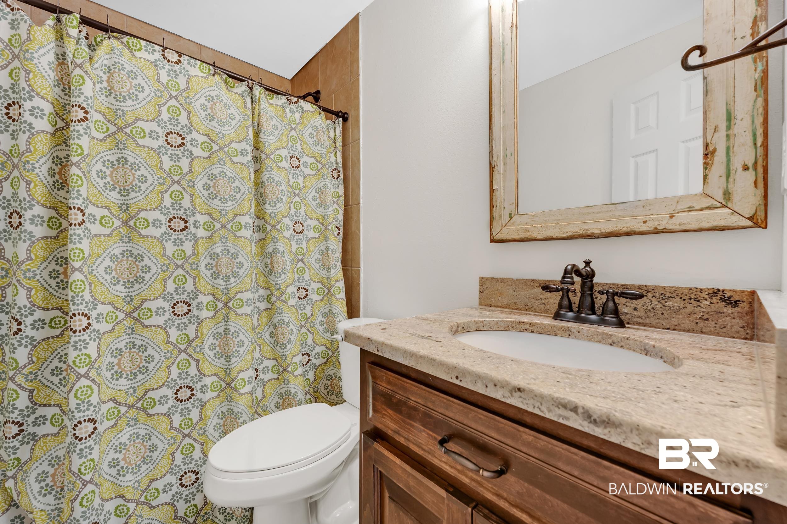 2 Navy Lane Daphne, AL 36527 - Photo 26 of 28 Bathroom featuring vanity and a shower with curtain