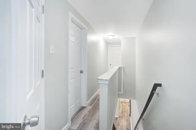 a view of a hallway with staircase