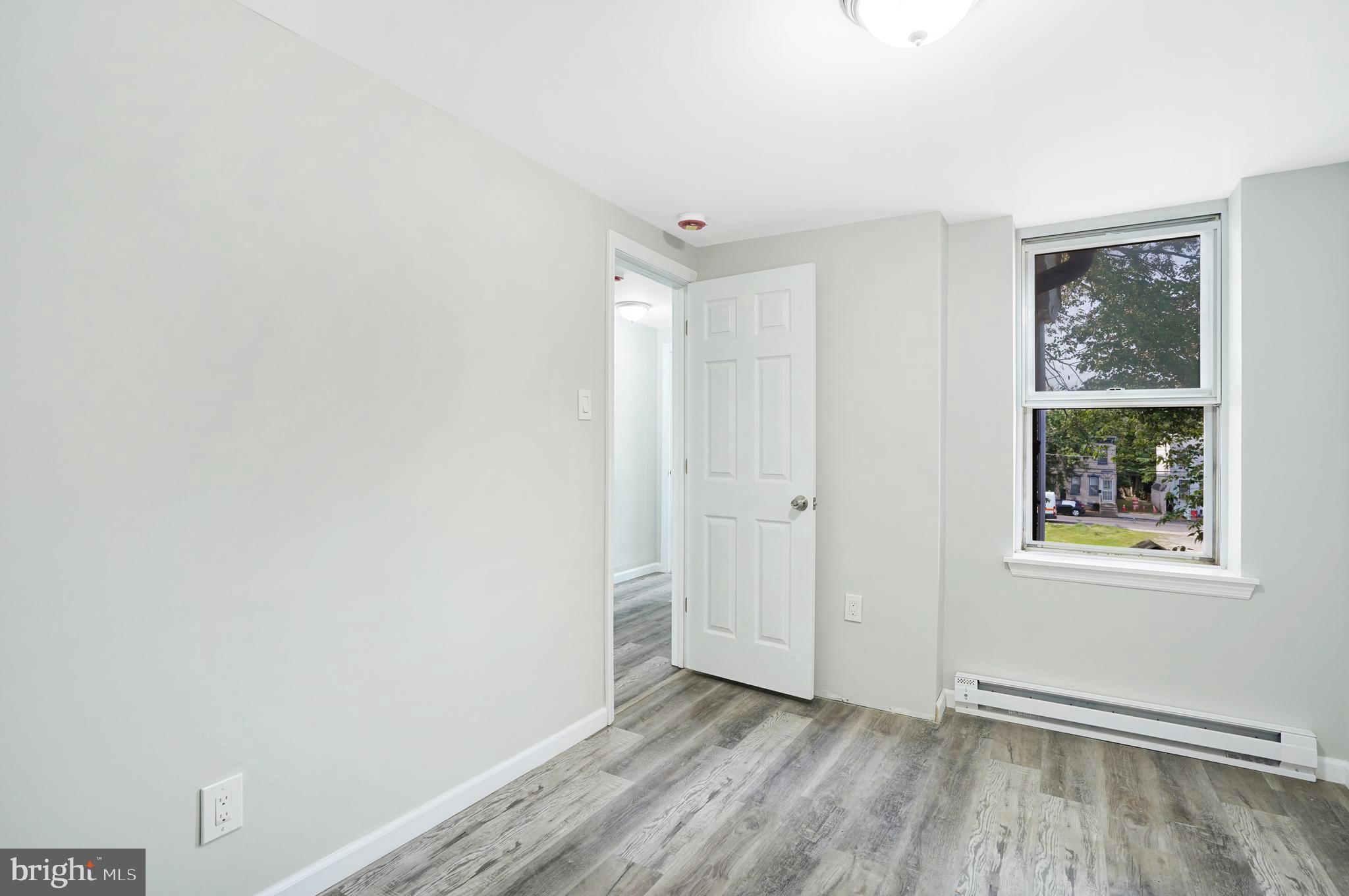565 Line Street Camden, NJ 08103 - Photo 19 of 31 a view of an empty room and window