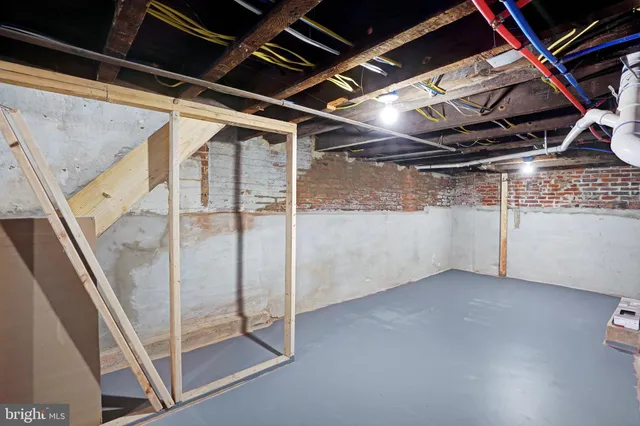 a view of empty room with wooden ceiling