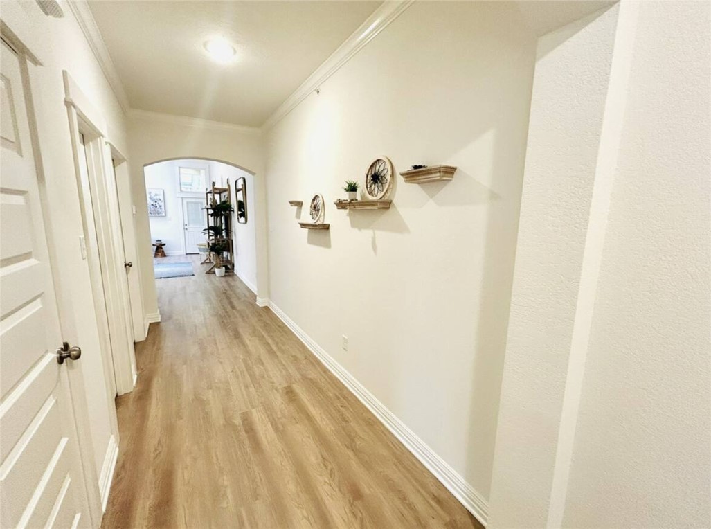 1536 Bennett Street Bryan, TX 77802 - Photo 12 of 35 Hallway featuring arched walkways, crown molding,