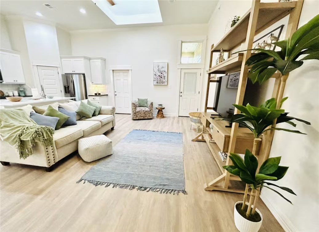 1536 Bennett Street Bryan, TX 77802 - Photo 15 of 35 Living room featuring a skylight, a high ceiling,