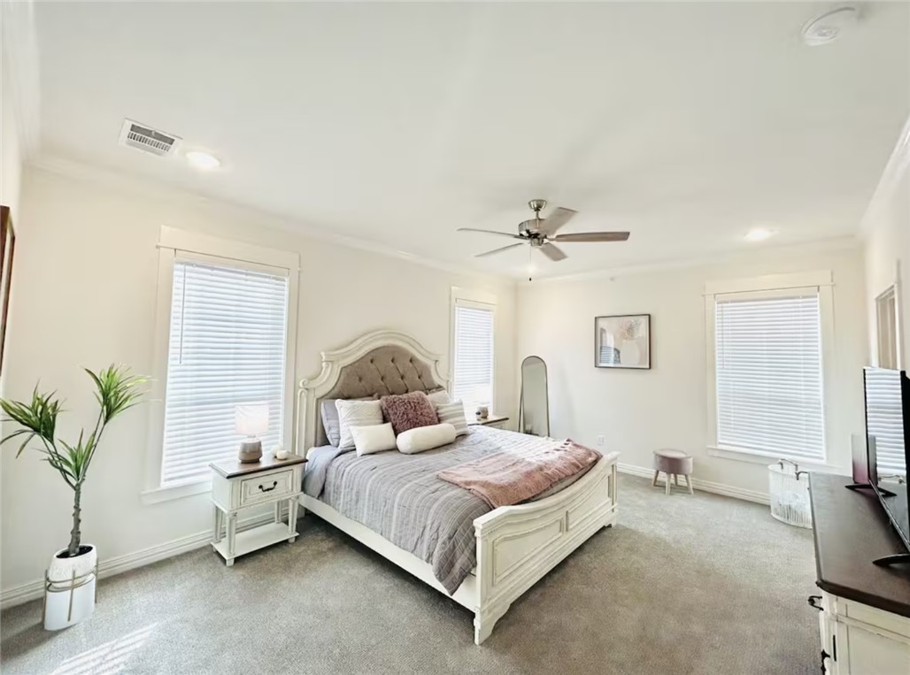 1536 Bennett Street Bryan, TX 77802 - Photo 22 of 35 Carpeted bedroom with crown molding, baseboards, r