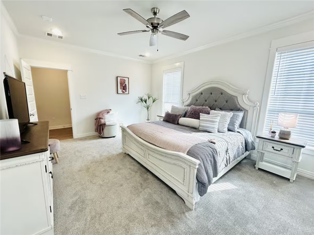 1536 Bennett Street Bryan, TX 77802 - Photo 24 of 35 Bedroom with light colored carpet, ornamental mold