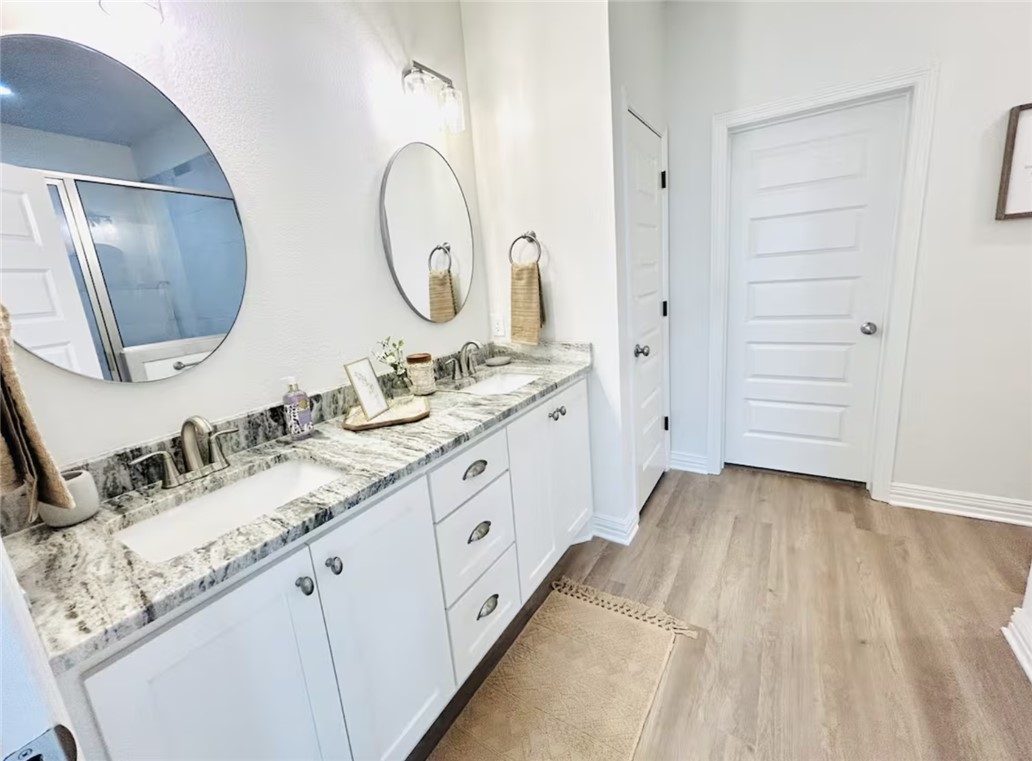 1536 Bennett Street Bryan, TX 77802 - Photo 27 of 35 Bathroom with wood finished floors, double vanity,