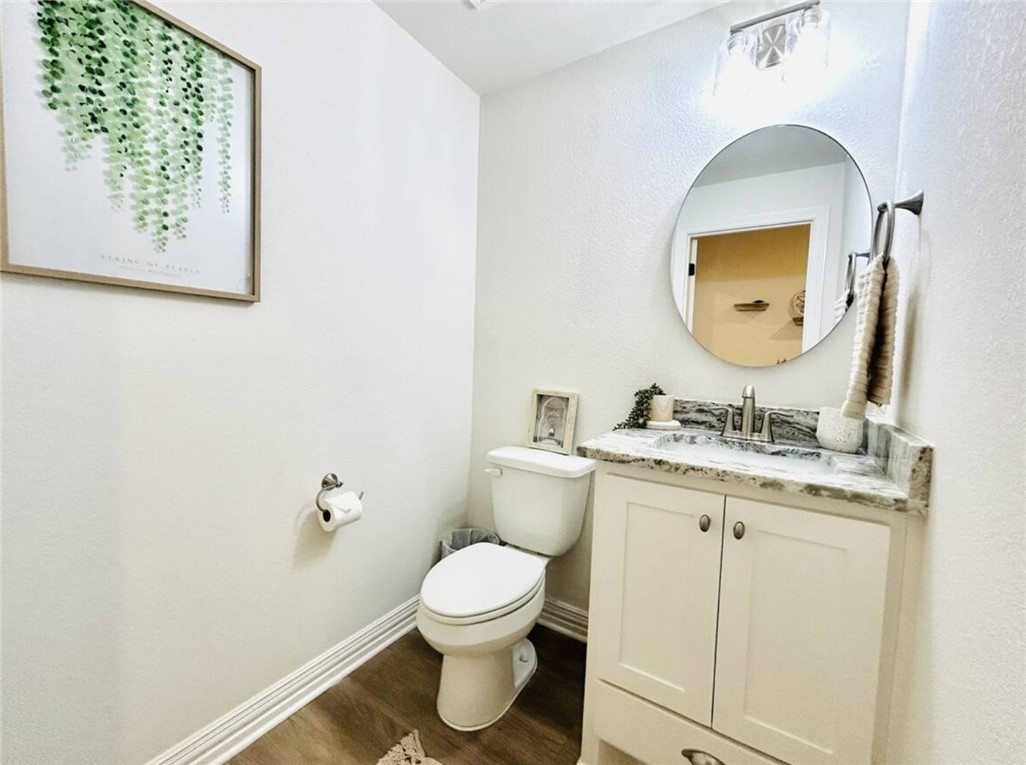 1536 Bennett Street Bryan, TX 77802 - Photo 32 of 35 Bathroom featuring wood finished floors, toilet, v