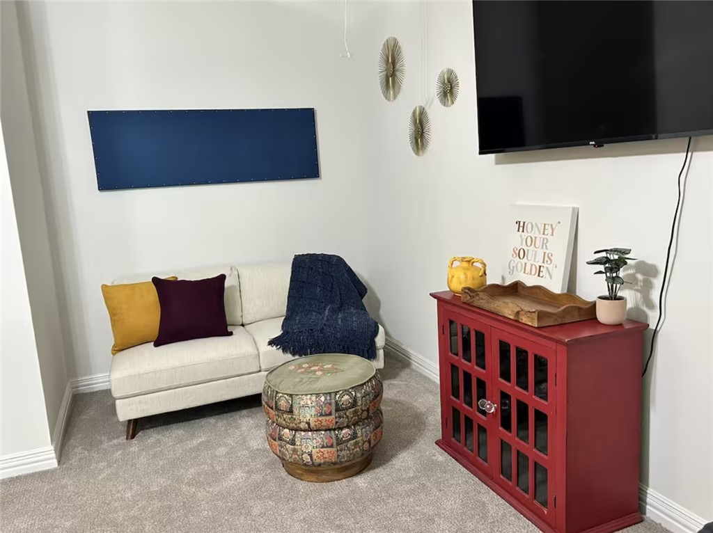 1536 Bennett Street Bryan, TX 77802 - Photo 33 of 35 Carpeted living room featuring baseboards