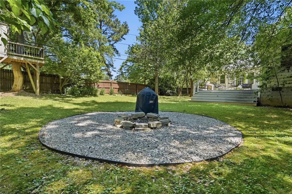 385 Sunset Drive Athens, GA 30606 - Photo 41 of 48 a view of a garden with large trees