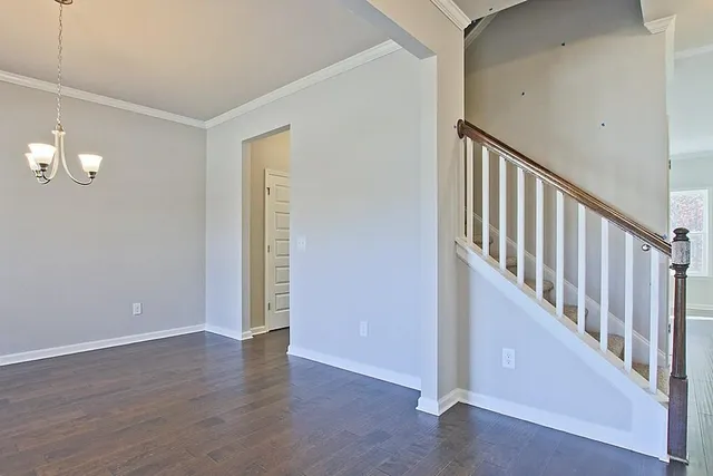 a view of an entryway with wooden floor