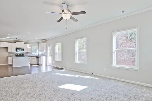 a view of a kitchen with furniture and windows