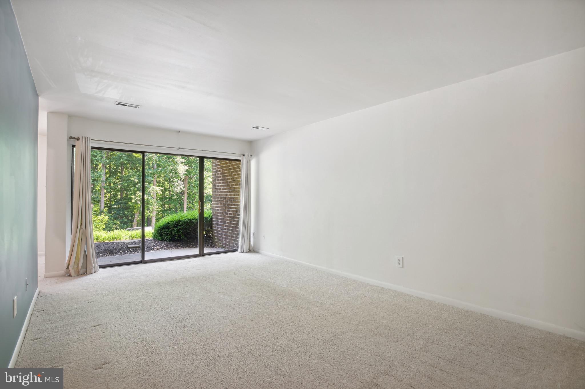 11240 Chestnut Grove Square, Unit 31 Reston, VA 20190 - Photo 7 of 26 Living room with patio access